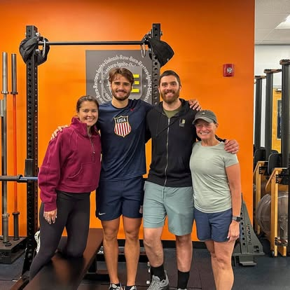Four members of the Train UFIT team standing together in the gym